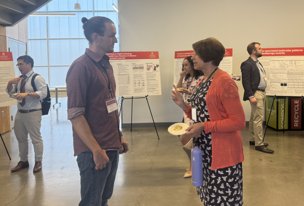 people talking at poster session